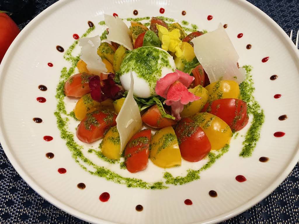 Colourful dish prepared at Le Petit Abuluzi