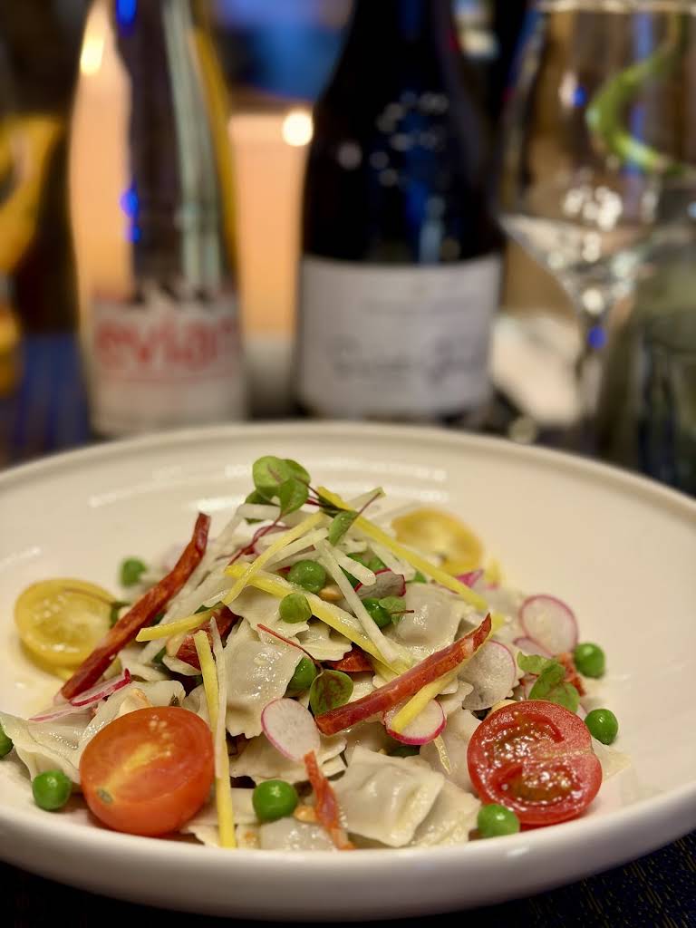 Momos and salad served at Le Petit Abuluzi